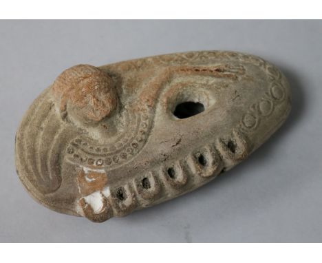 A Roman or later terracotta oil lamp, modelled as a Goddess