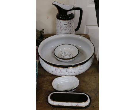A tin and enamel wash bowl, jug, etc.
