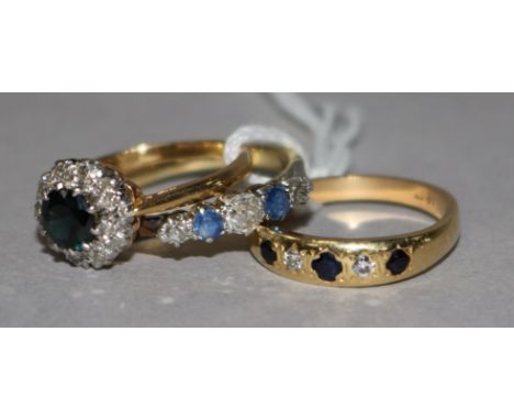 Three assorted 18ct gold, sapphire and diamond dress ring, including half hoop, gypsy set and cluster.