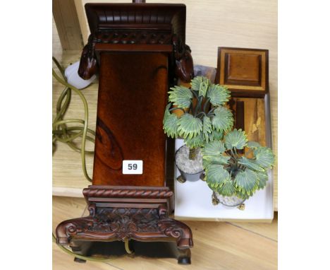 A pair of palm tree ornaments, three boxes and a lamp