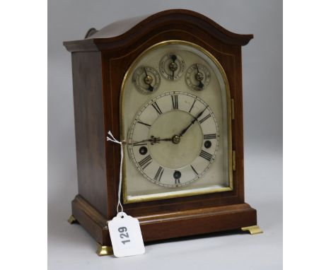 A chiming mahogany mantel clock