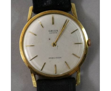A gentleman's gold Gruen precision manual wind wrist watch.