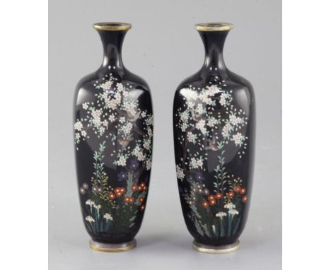 A pair of Japanese silver wire cloisonne enamel hexagonal vases, Meiji period, decorated with birds amid flowers, on a midnig