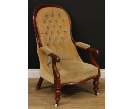 A Victorian mahogany library chair, deep-button back, stuffed-over upholstery, scroll hand rests, turned forelegs, 103cm high