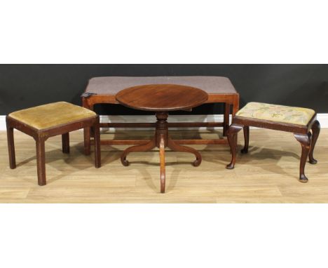 A 19th century mahogany low tripod occasional table, 52cm high, 57.5cm diameter; a 19th century mahogany stool, 39cm high, 46