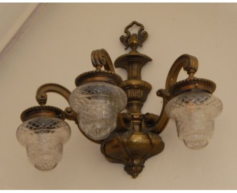 A pair of three light wall lights, clear glass shapedCs= scroll arms**This lot is located at Cressbrook Hall, SK17 8SY;  Coll