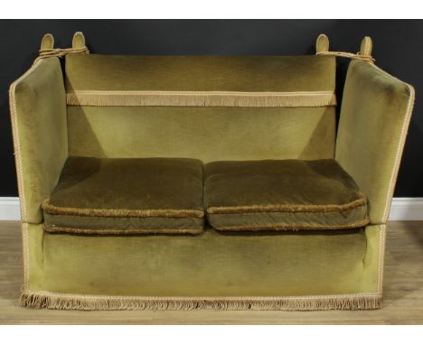 A Knole type drop-arm sofa, stuffed-over and passementerie trimmed upholstery, squab cushions, 98cm high, 147.5cm wide (close