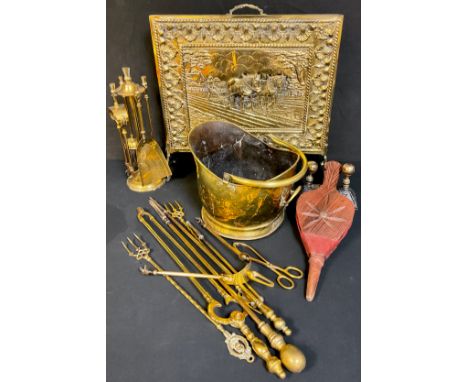 Brassware - Georgian fire tongs; a fireside companion set with thistle finials; other fireside tools; a helmet shaped coal sc