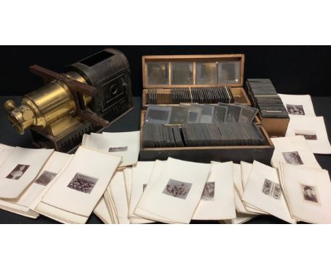 A late 19th/early 20th century magic lantern projector; a collection of magic lantern slides, nature, religion, topographical