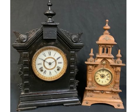 A 19th century German oak architectural mantel clock, 37.5cm high; another, American, Ansonia Clock Co., ebonised case, 43cm 