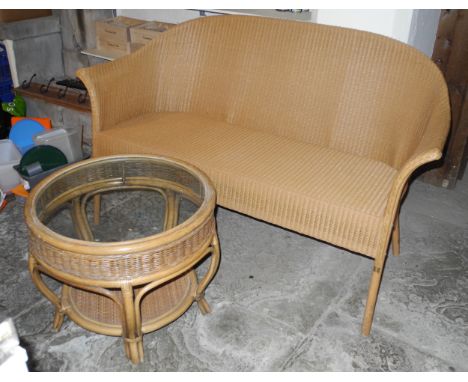 A Lloyd Loom two seat sofa, 148cm long;  a wicker conservatory table**This lot is located at Cressbrook Hall, SK17 8SY;  Coll