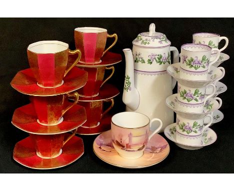 An early 20th century Royal Worcester coffee service for six comprising coffee pot, coffee cans and saucers; a set of six Roy