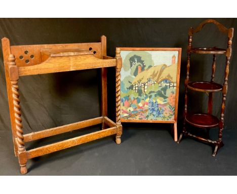 A 20th century oak umbrella stand, hinged central compartment, barley twist legs, 70cm wide, 78cm high, c.1930;  an oak three