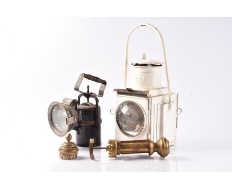 BR Signal Lamps and a GWR Carriage Lamp, two BR hand held signal lamps, one acetylene fuelled, black painted of cylindrical f