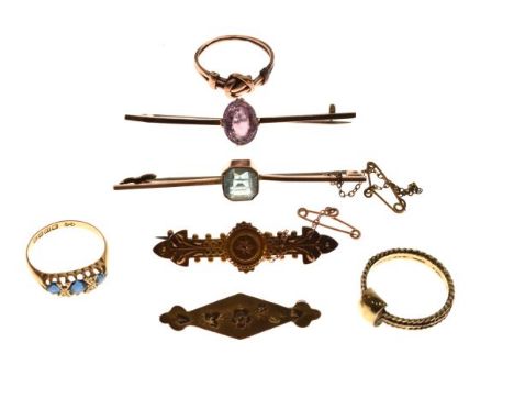 Two bar brooches marked 9ct and one other Victorian target bar brooch stamped 15ct, a 9ct gold rhomboid shaped bar brooch, a 