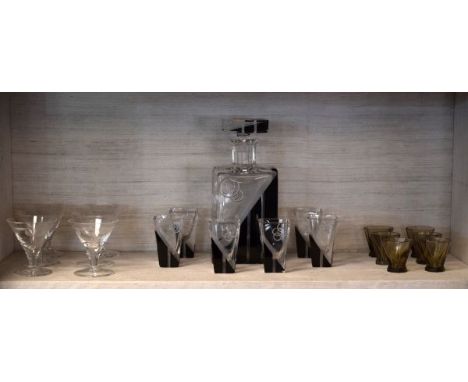 Art Deco design black and clear cut glass liqueur decanter and six matching glasses in the manner of Baccarat together with a