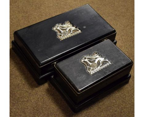 Two ebonised boxes, both having silver plated mount with a stylised Art Deco design stag motif   Condition: 