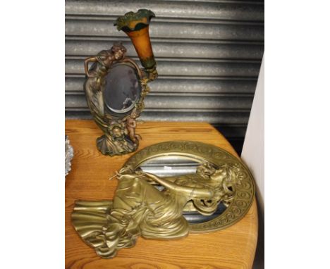 Reproduction Art Nouveau style resin figural circular wall mirror depicting a female holding a flower, together with a simila