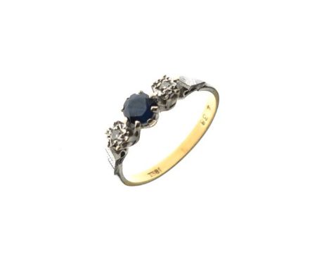 Dress ring having central sapphire coloured stone, flanked each side by a diamond, the white metal shank stamped 18ct, size N