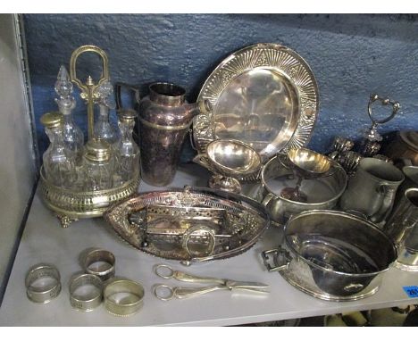 A mixed lot of silver plate, copper and brassware to include an oil lamp, tankards, cocktail shaker and a fan