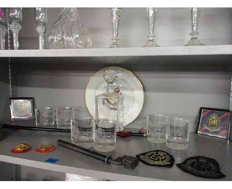 A Royal Military Police flag and related paperweights, cloth and gilt badges, a plate, decanter and six matching tumblers etc