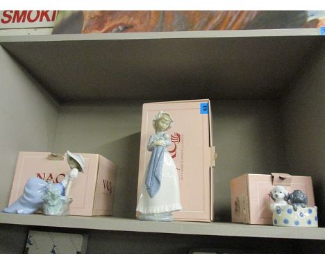 Three boxed Nao figures