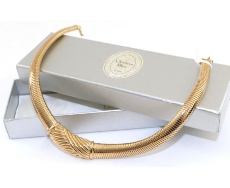 A Christian Dior Necklace, a scroll centre to a broad tapering snake chain, measures 42cm long, in a Christian Dior boxThe ne