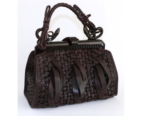 A Christian Dior Samourai Woven Leather Handbag, in burgundy woven leather, with acrylic faux tortoiseshell clasp and snake m