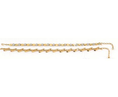 Two Gilt Metal Necklace, by Trifari, one with paste set clusters spaced by textured links, length 40cm, the other formed of t