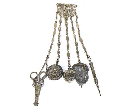 Silver Chatelaine of Floral Scrolled Form, with hinged clip hung with five accessories on fancy link silver chains, including