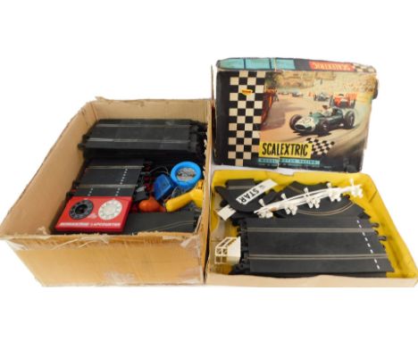 A Scalextric model motor racing set, lacking cars, boxed, together with First Scalextric. (a quantity) (AF)
