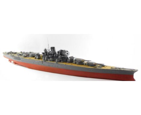 A scale model of a Japanese WWII battle ship, possibly The Yamato, modeled with armourments, deck planes, etc., 131cm wide.