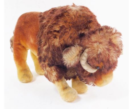 A soft toy figure of a bison, possibly Steiff, 37cm wide.