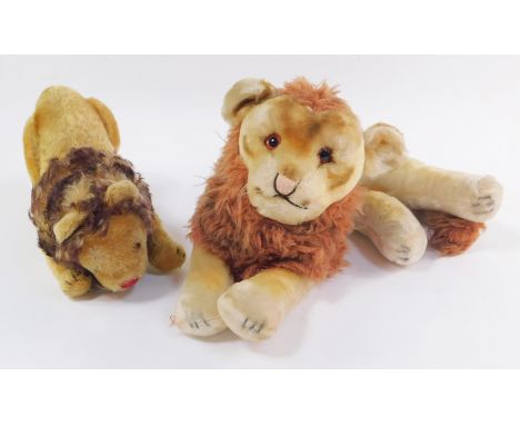Two soft toy lions, possibly Steiff, comprising a Leo The Lion, and a standing lion with a stitched red nose. 
