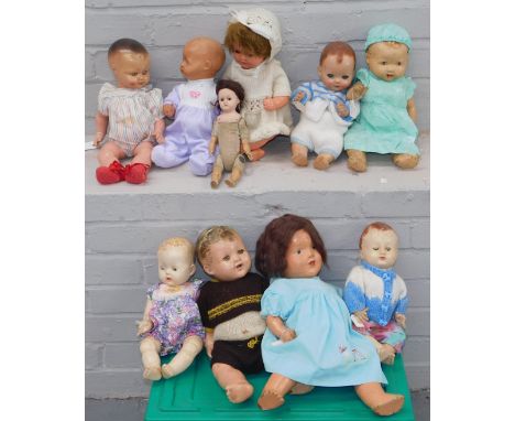A group of papier mache and plastic headed dolls, to include one ceramic headed doll with material body marked DPC49?4. (2 bo