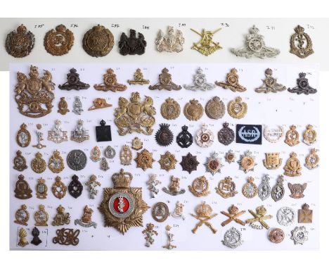 A collection of approx. 90 military cap badges displayed on two sheets including Royal Engineers, Royal Horse Artillery, Roya