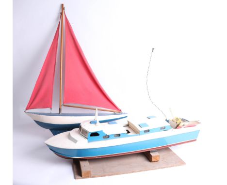 Enya, model cabin cruiser boat with engine, together with a pond yacht (2).