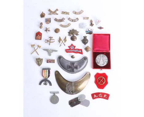 An assortment of various loose cap badges, including King's, Stafford, ATF cloth patch, a French medallion case and WWII meda