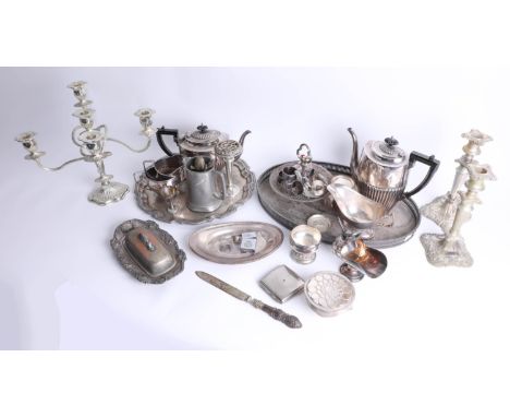 A quantity of silver plated wares including candelabra, tea service and tray.