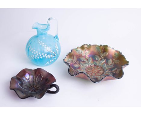 A Victorian blue glass and enamel jug, two purple carnival glass dishes.