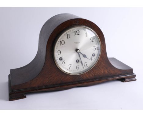 An oak-cased 1940s chiming mantle clock, sold by Bowden's of Plymouth.