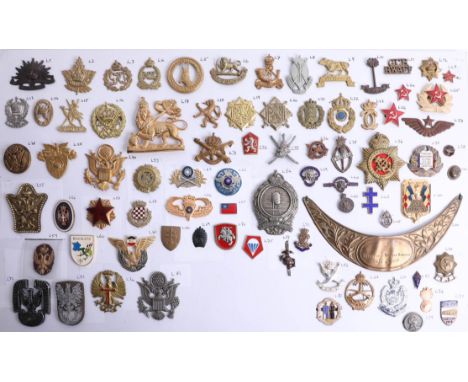 A collection of approx. 75 military cap and other badges of foreign and overseas forces including Sudan Defence Force, Tonga 