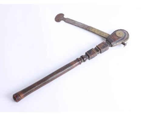 An unusual carved wood and steel axe with brass mounts, length 42cm. Part of the Late Reverend Geoffrey Garner collection.