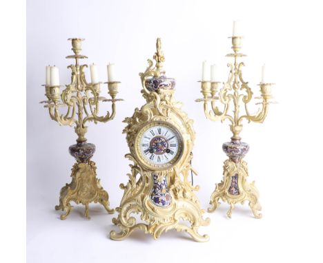 Three piece clock garniture set, with gilt casings and enamel decoration, movement signed 'Japy Freres', with eight day, move