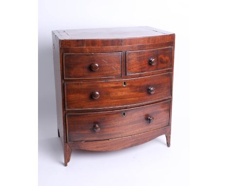 A miniature mahogany bow front chest, fitted with two short and two long drawers on splayed bracket feet, height 44cm, width 