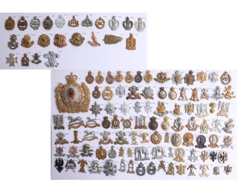 A collection of approx. 119 military cap badges displayed on two sheets, including a helmet plate from the Household Cavalry 