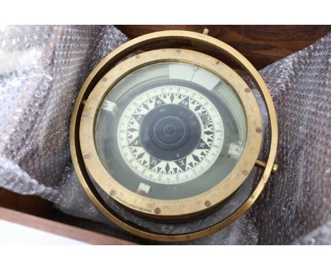 A large ships compass, Wilhelm Rudolph-Bremen diameter 30cm, together with a Donald Duck soft toy.