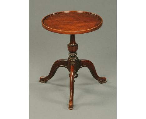 A 19th century low occasional tripod table, with circular dished top.  Diameter 34.5 cm. 