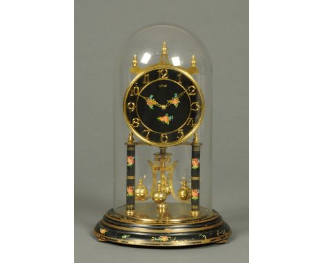 A 400 day clock, with floral decoration and housed under a glass dome.  Height including dome 32 cm. 