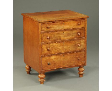 A Georgian mahogany commode chest drawers, four long drawers with wooden knob handles and raised on turned legs.  Width 66 cm